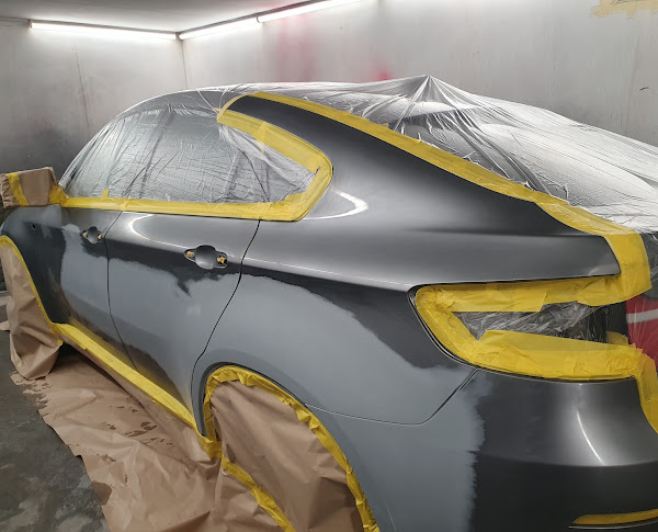 Car masked up in the Motortech spray booth during a respray